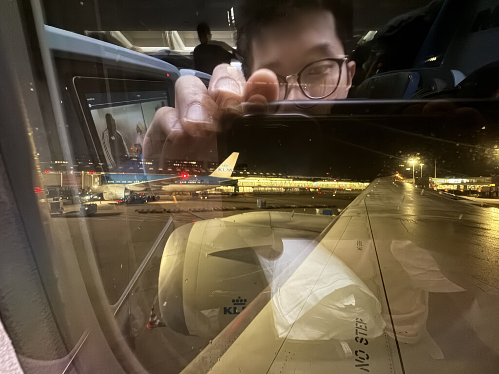 a person taking a selfie in a plane