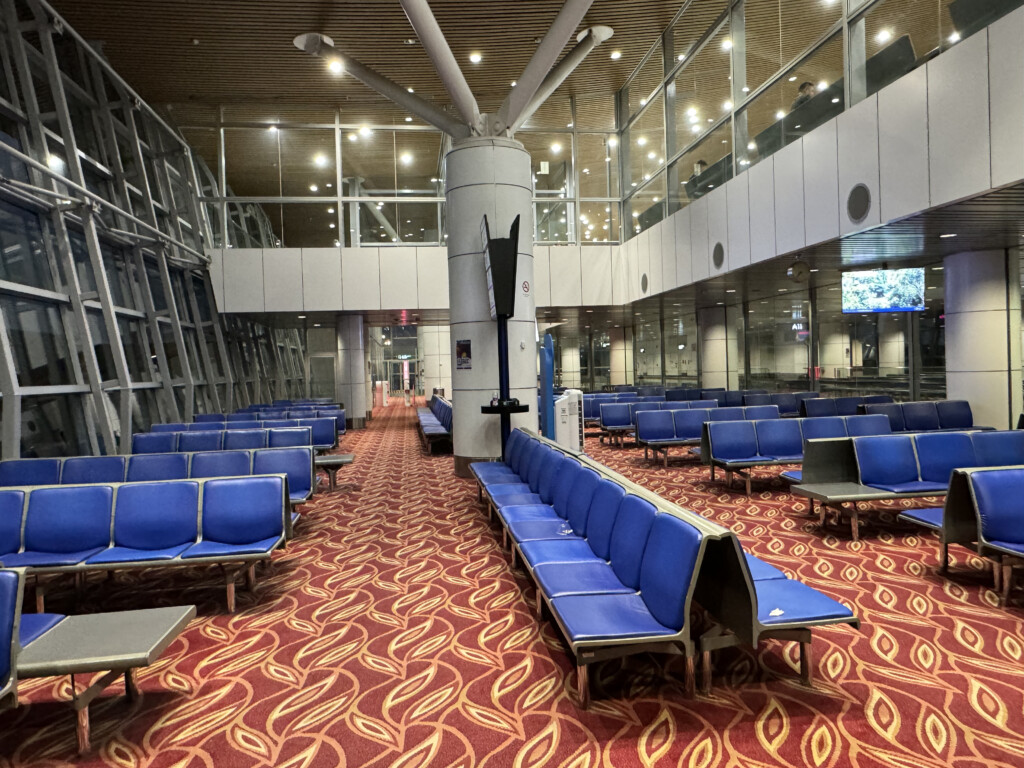 a group of blue seats in a room