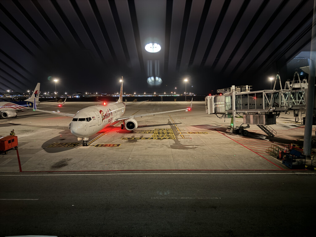 an airplane on the tarmac at night