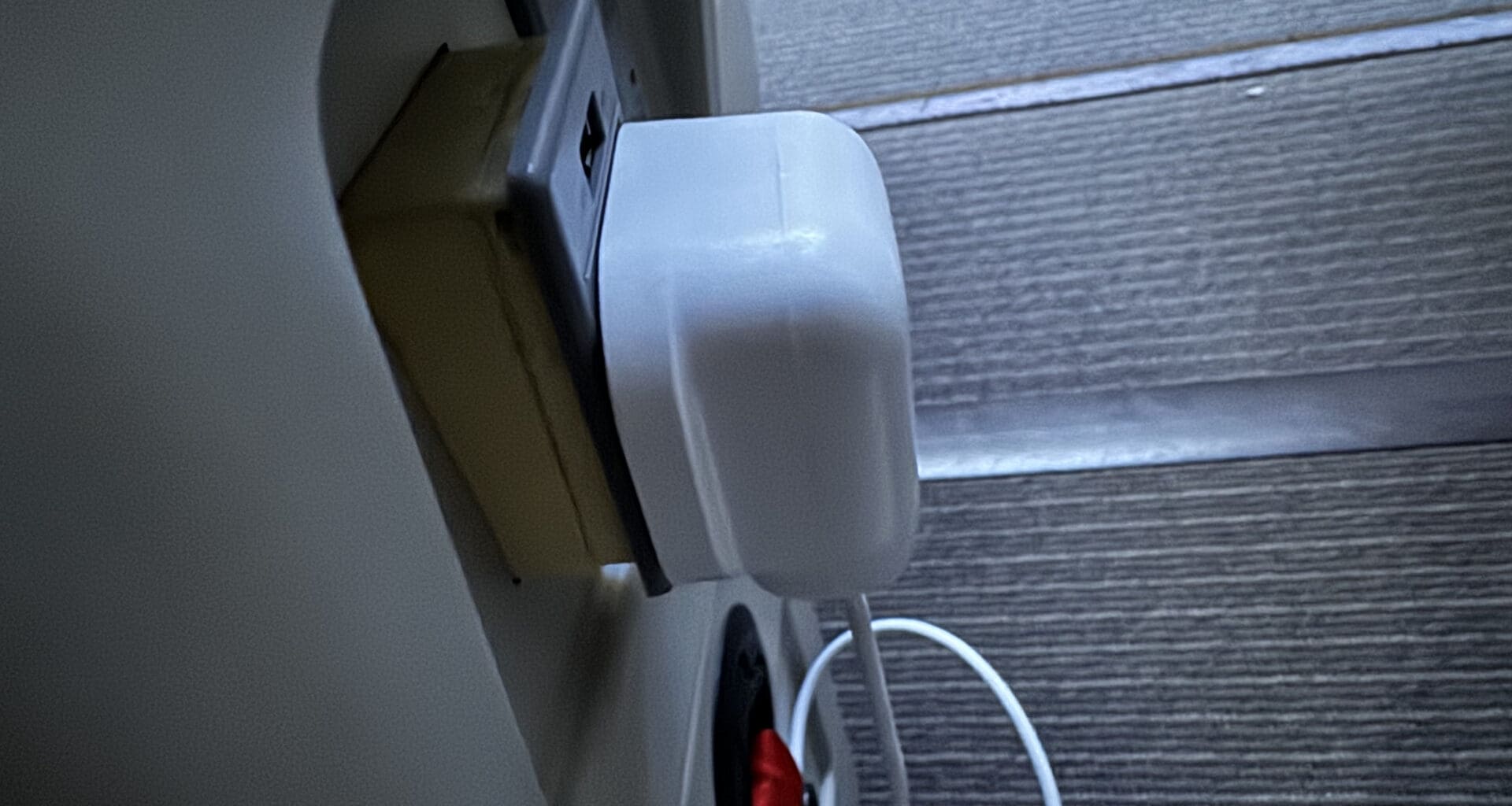 a white plug in a wall