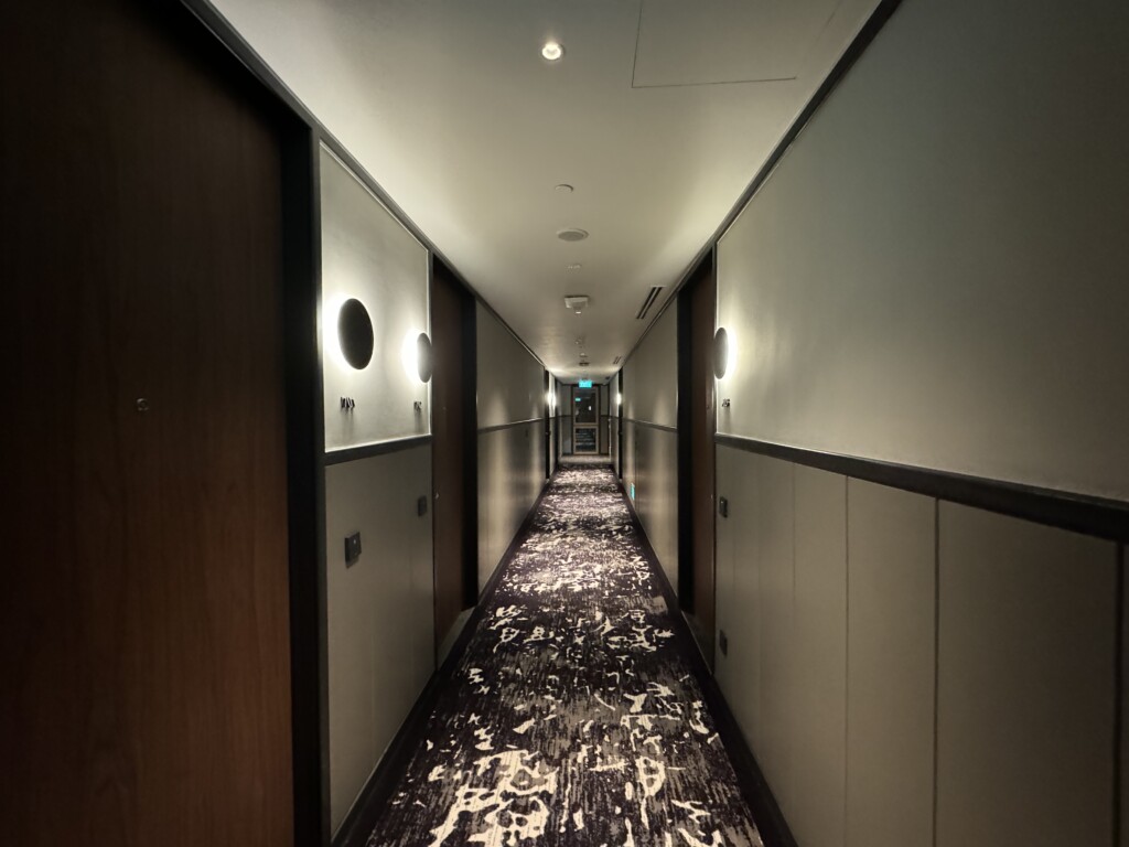 a hallway with a carpeted floor