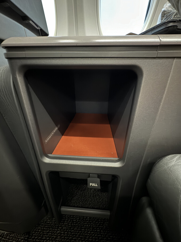 a small open drawer in a car