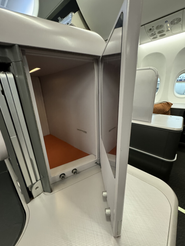 an airplane cabin with a door open