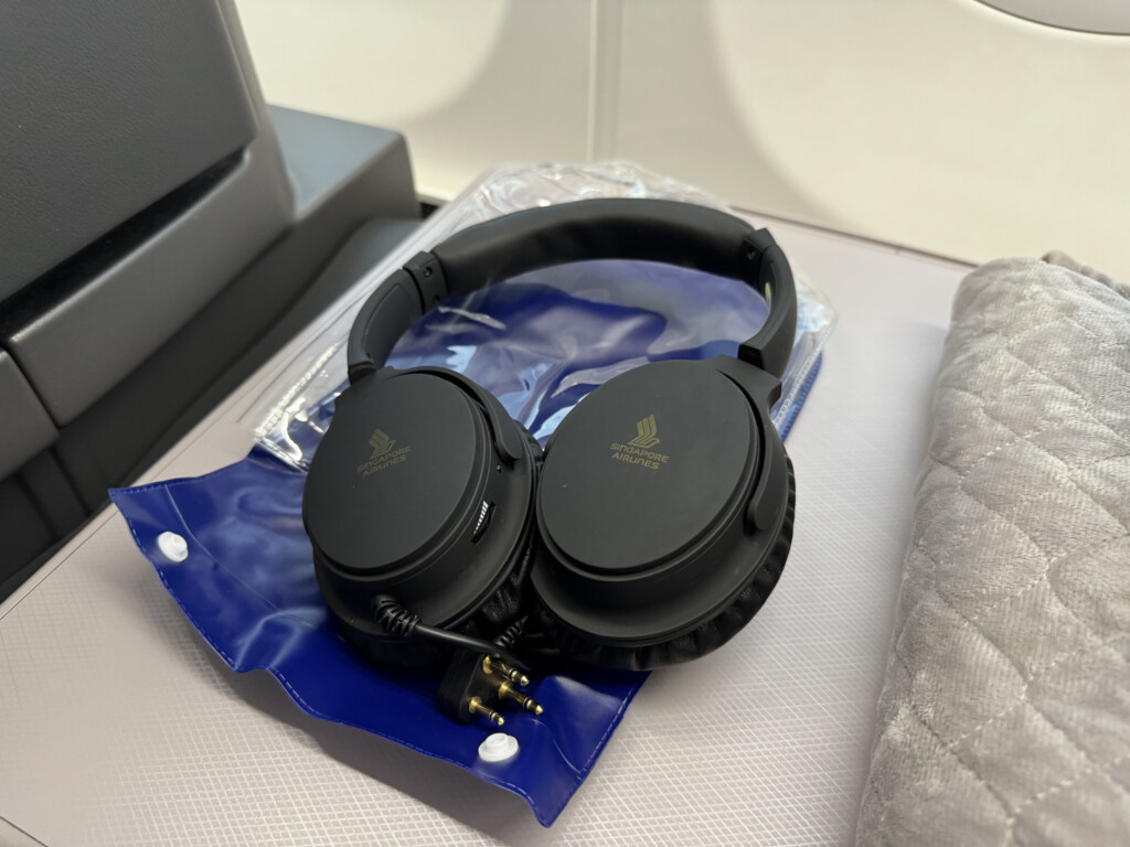 a pair of headphones on a blue bag