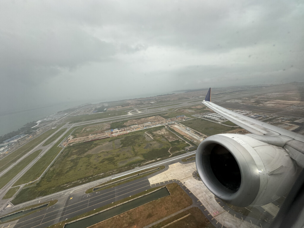 an airplane wing and a runway