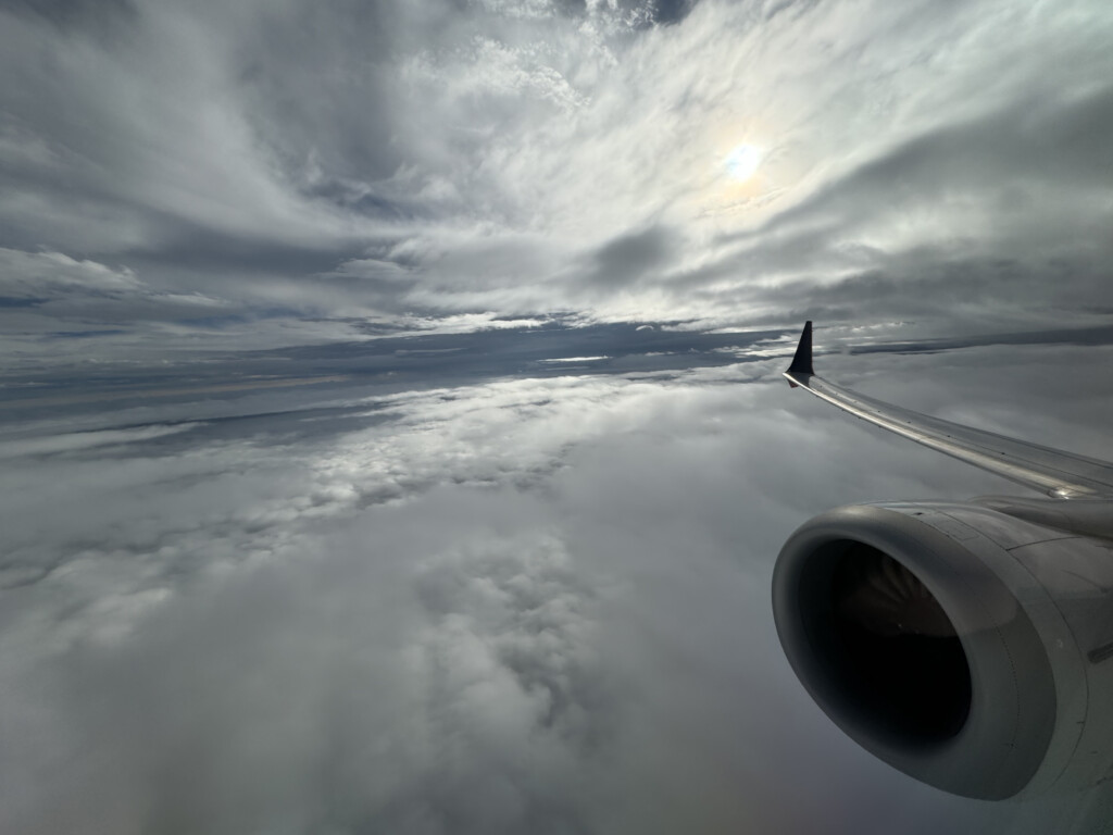 an airplane wing in the sky