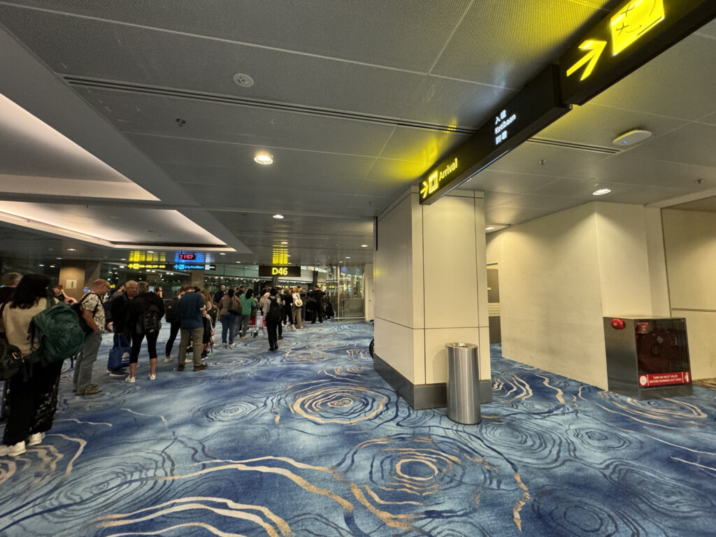 a group of people walking in an airport