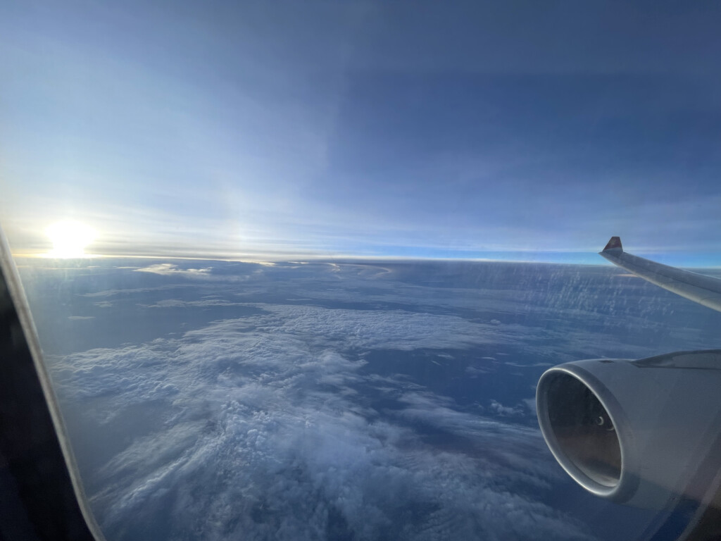 a view of the sun from an airplane window