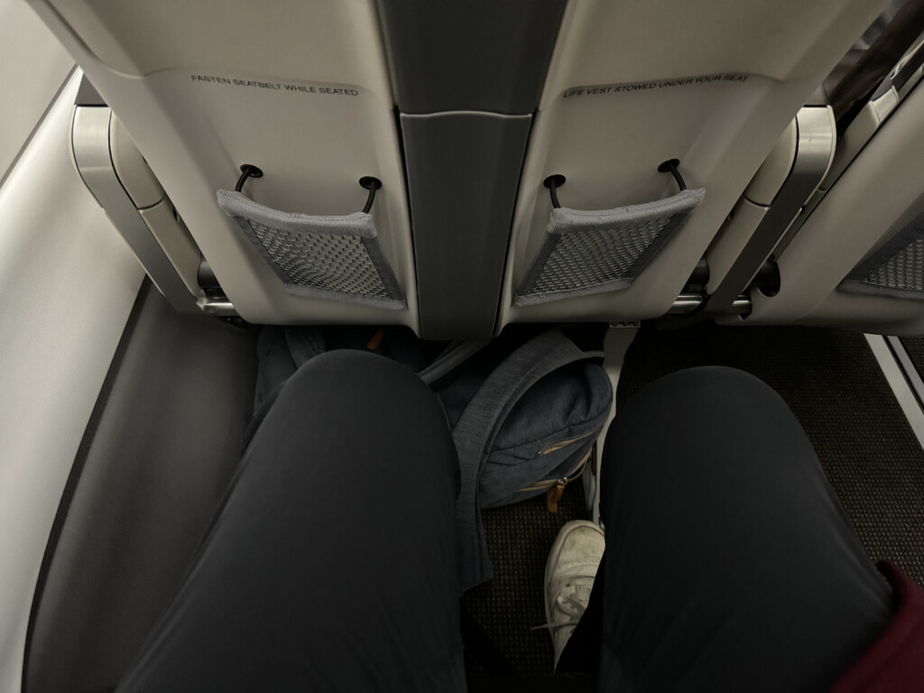 a person's legs in a seat