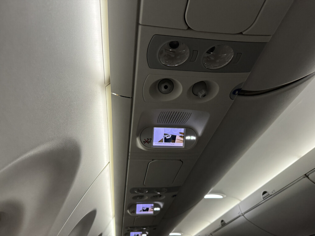 a overhead panel with a screen and a video game on it