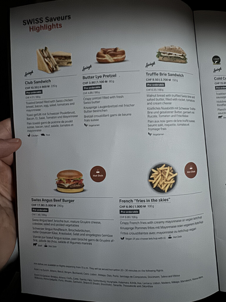 a hand holding a menu