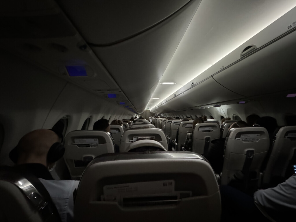 a plane with seats and people in it