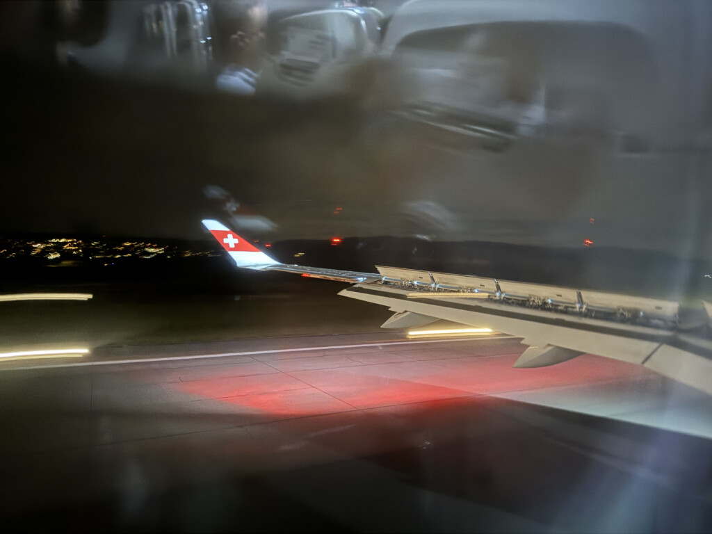a plane wing with a red light on it