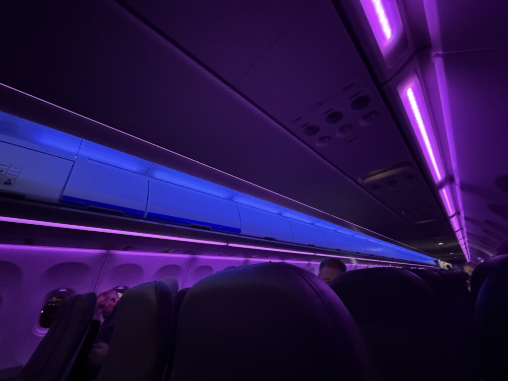 inside an airplane with purple lights