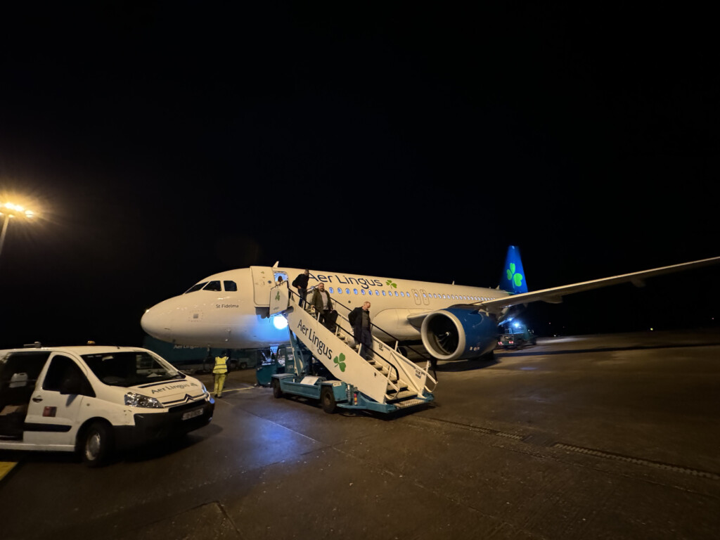 a plane with stairs and people on it