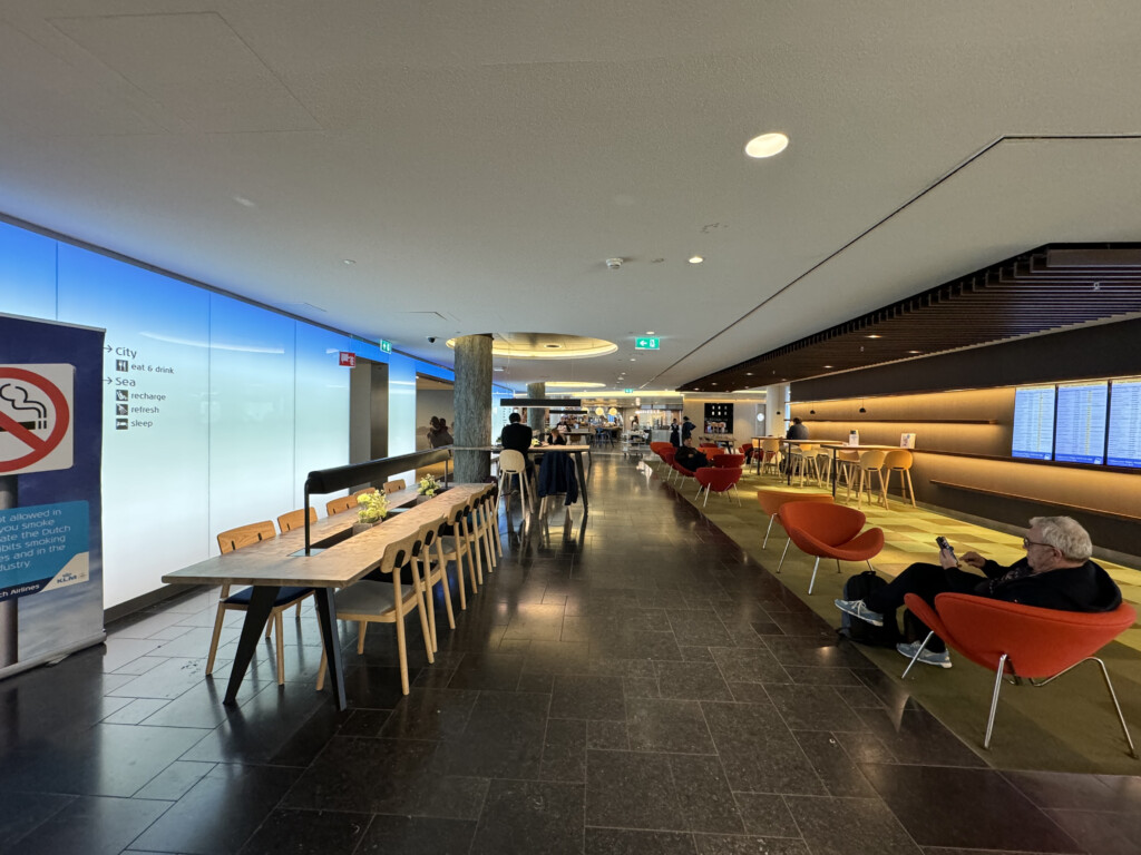 a long hallway with tables and chairs