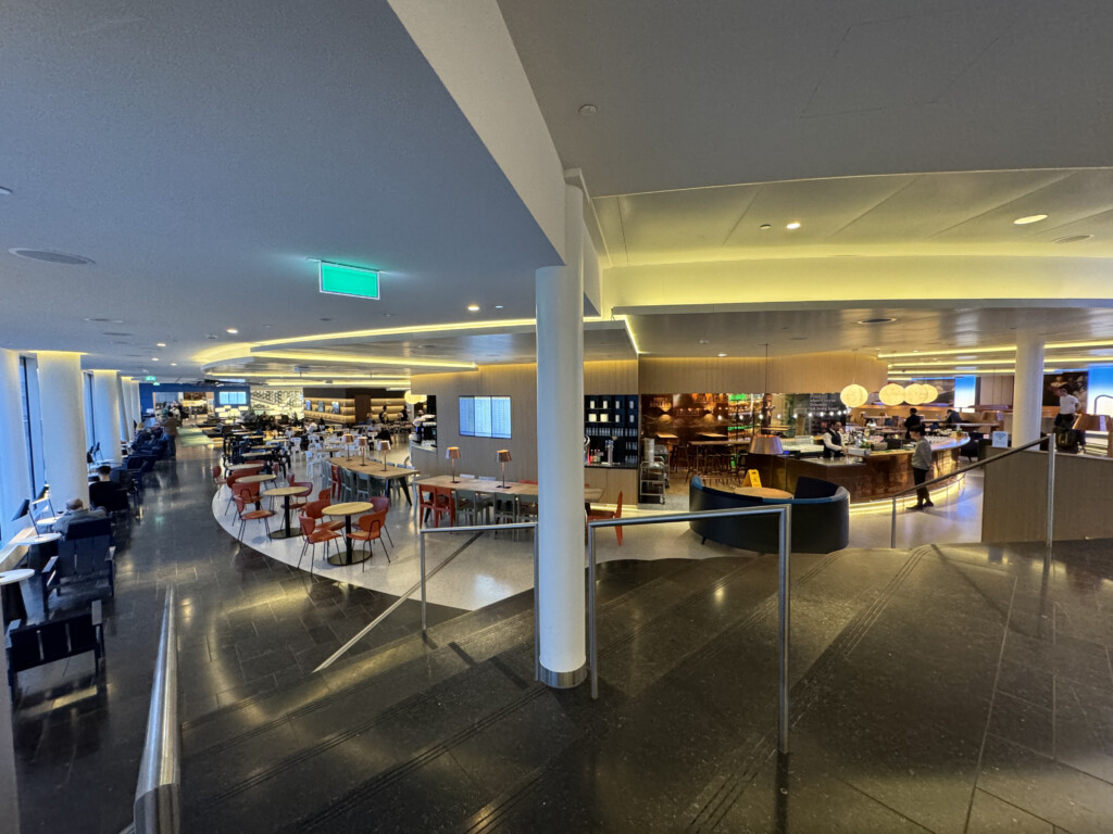 a large building with tables and chairs