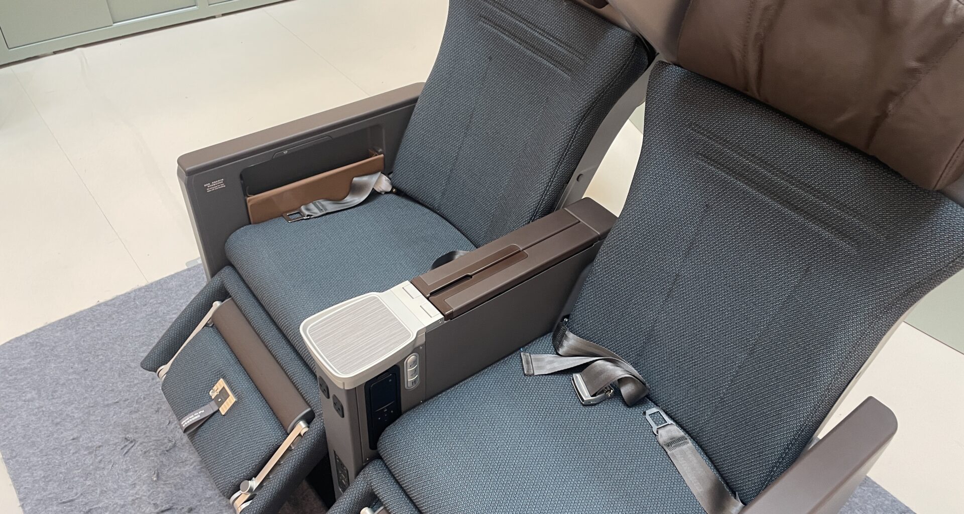 a seat with armrests and arm rest