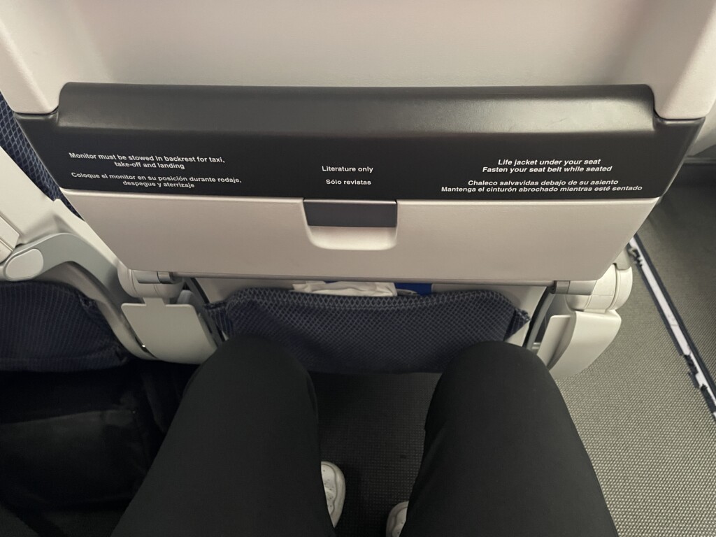 a person's legs in a seat