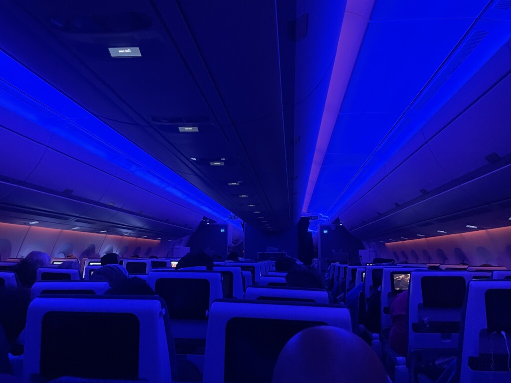 inside an airplane with blue lights