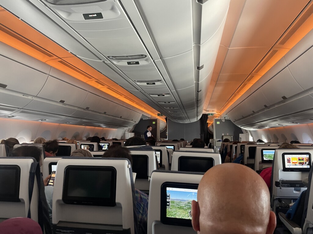 a group of people sitting in an airplane