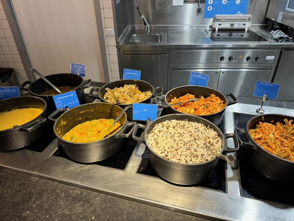 a group of pots of food on a stove