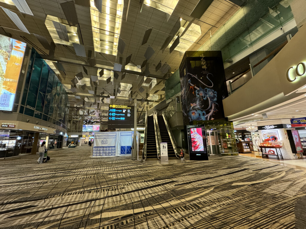 a large airport with stairs and signs