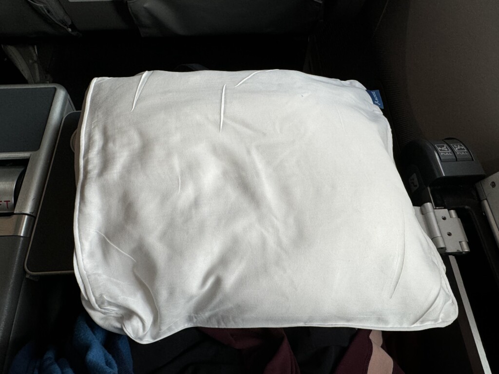 a white pillow on a chair