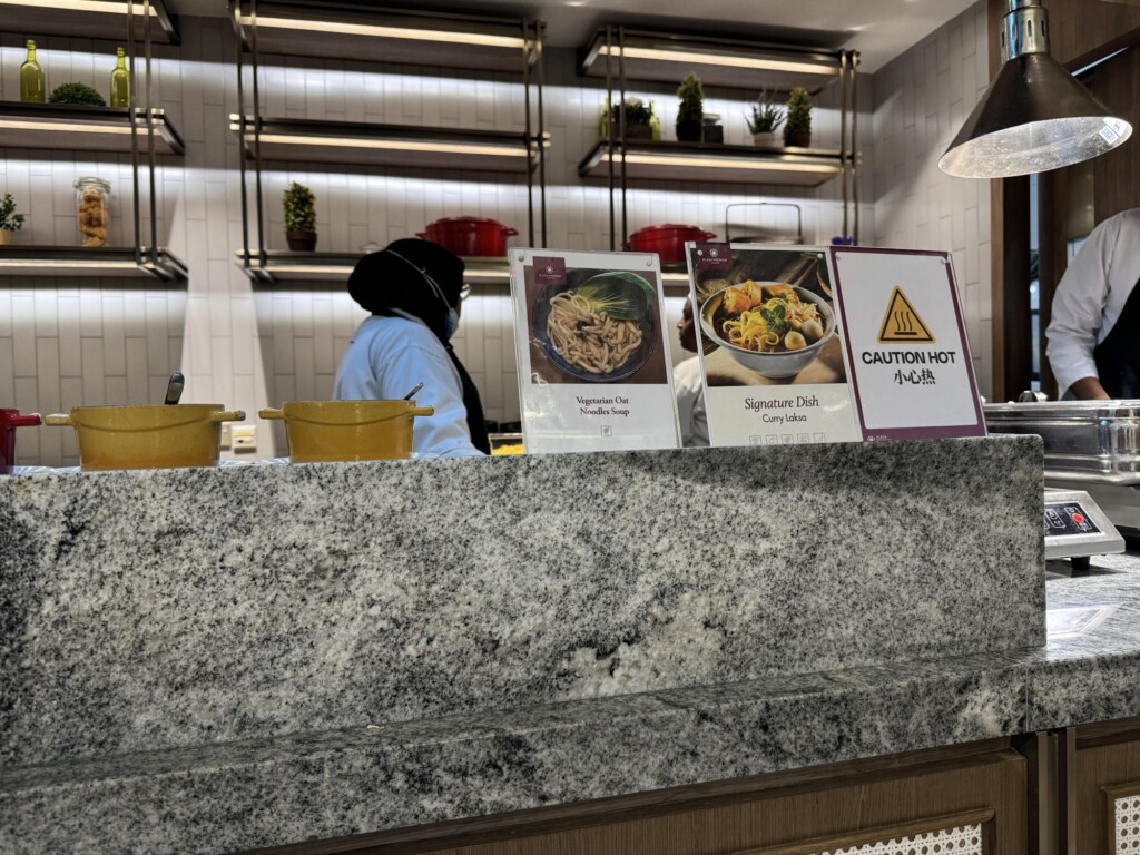 a person standing behind a counter with signs