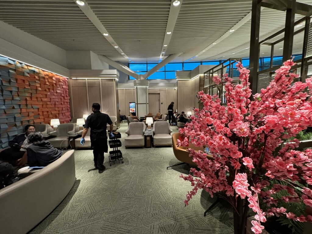 a man in a cleaning uniform in a hotel lobby