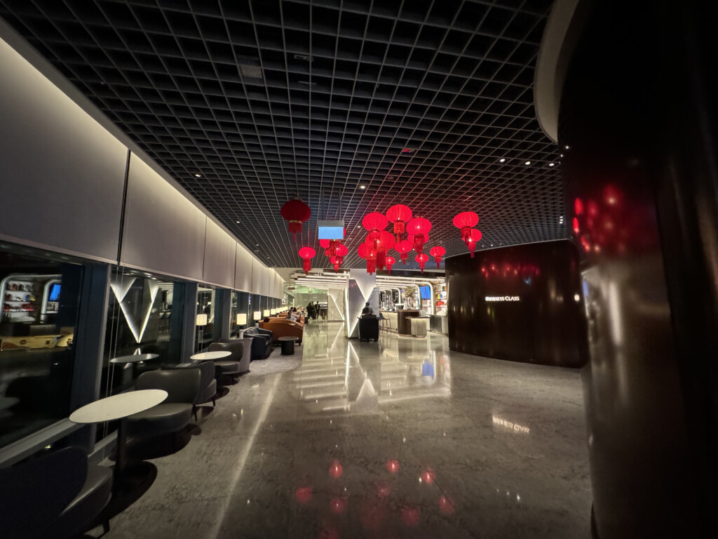 a room with red lanterns from the ceiling