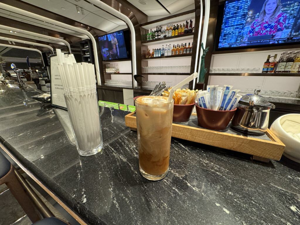 a glass of iced coffee on a counter