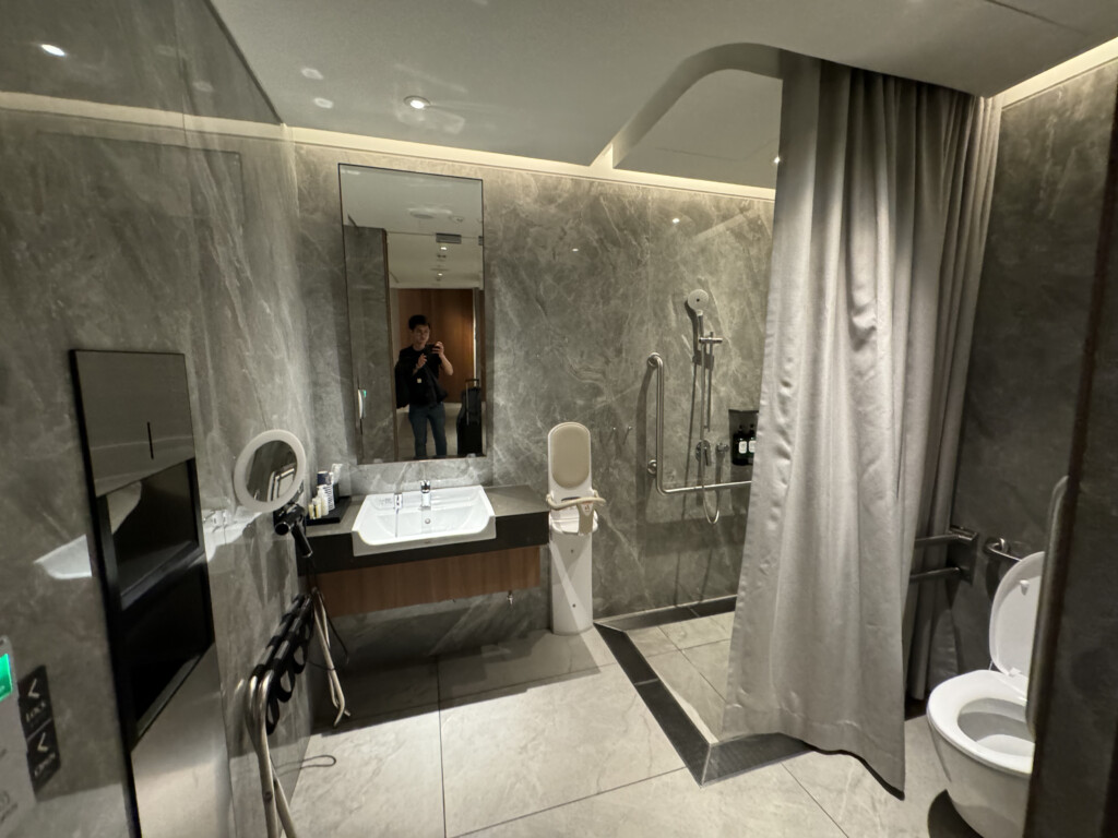 a bathroom with a sink and shower