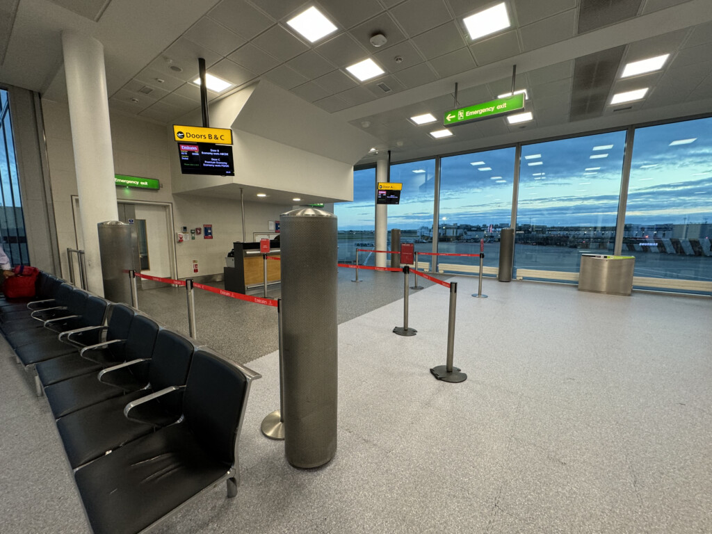 a row of chairs in a airport terminal