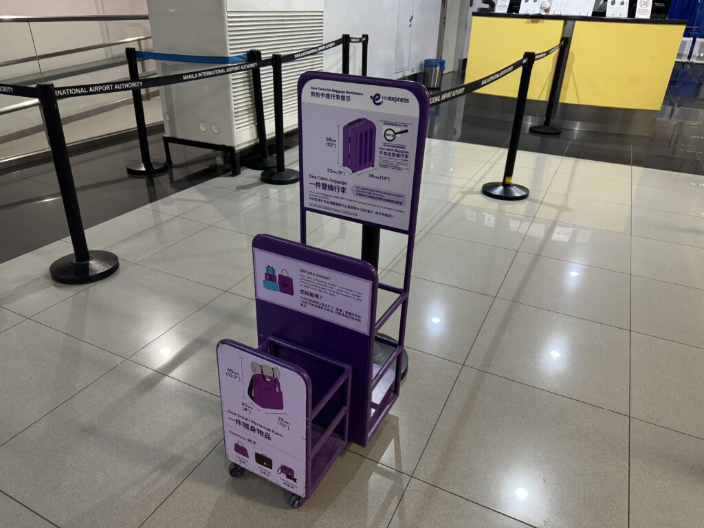 a purple luggage cart in a airport