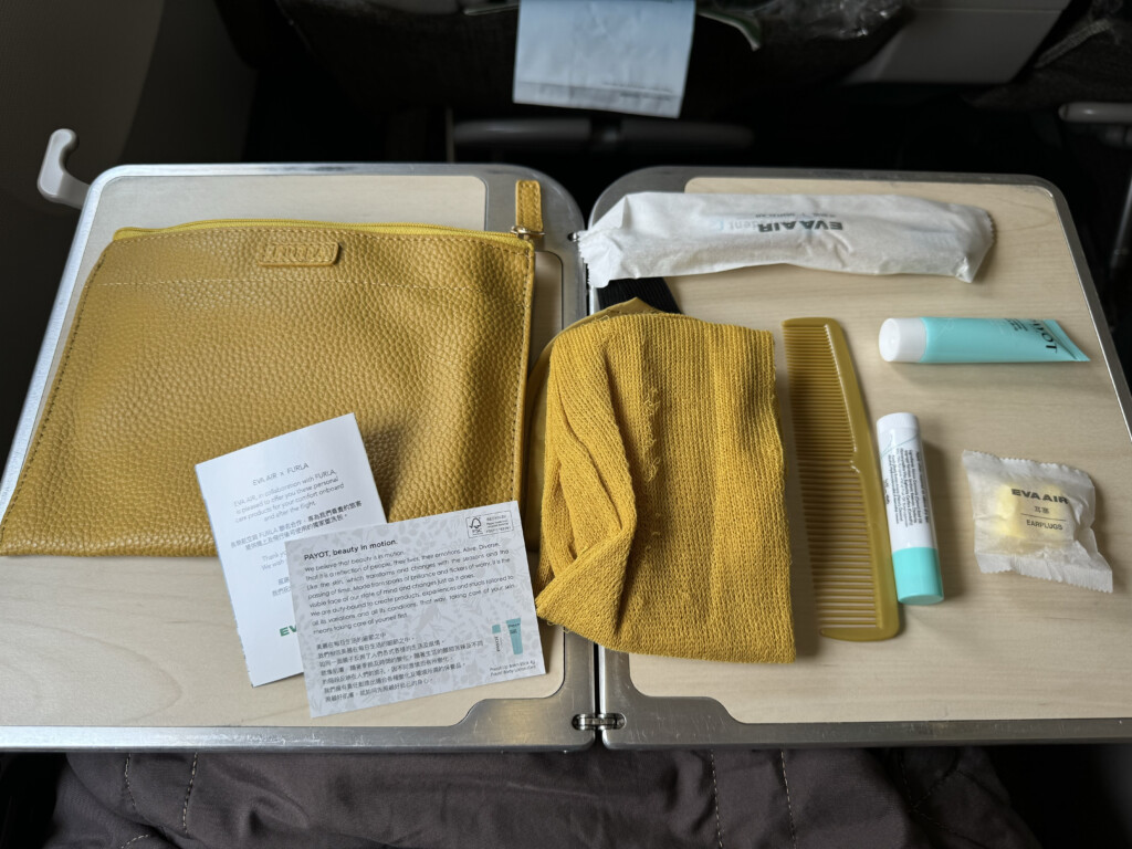 a yellow bag and comb on a table