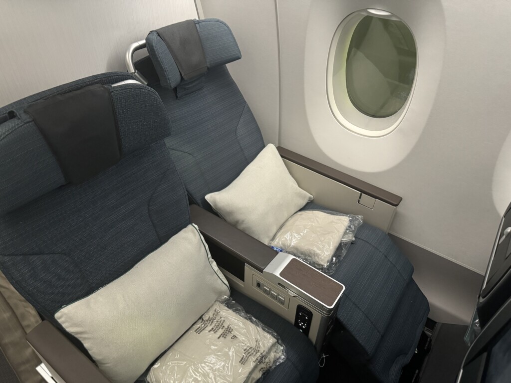 a seat with pillows on the side