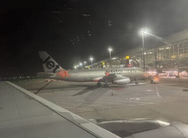 an airplane on the runway at night