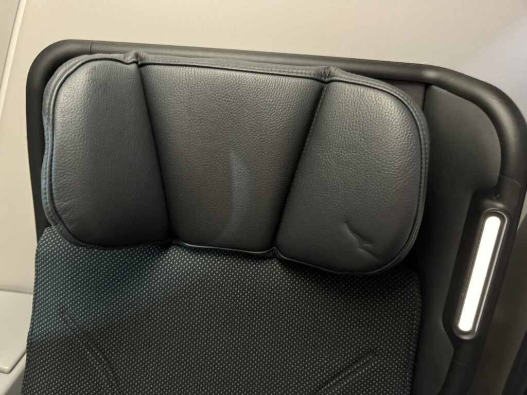 a black seat with a black cushion