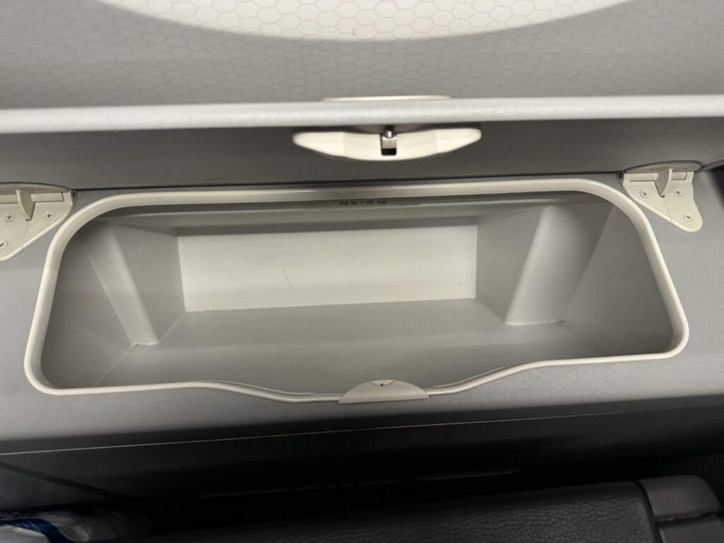 a white plastic container in a car