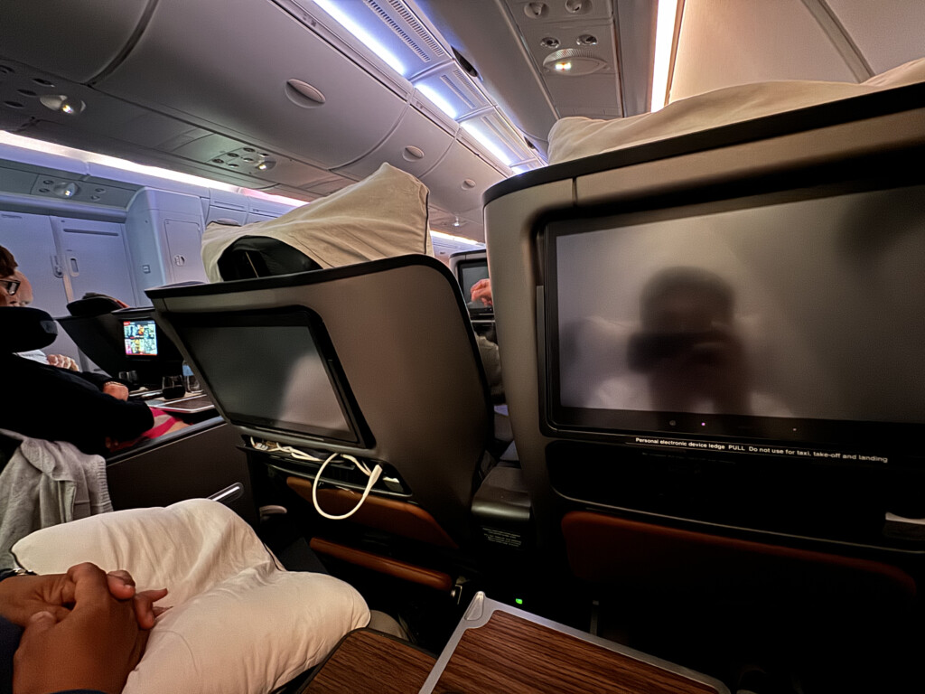 a group of people sitting in an airplane