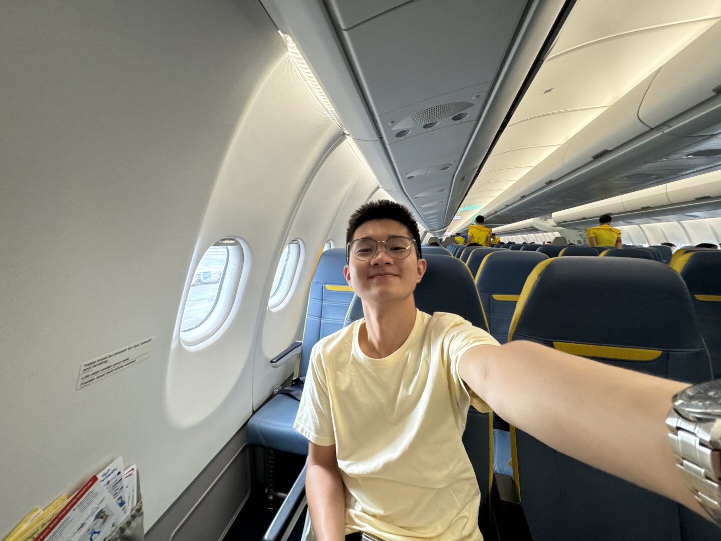 a man taking a selfie in an airplane