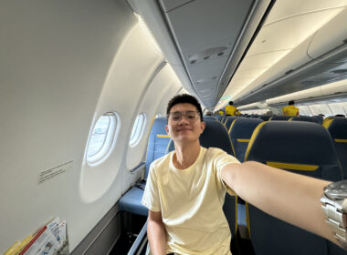 a man taking a selfie in an airplane