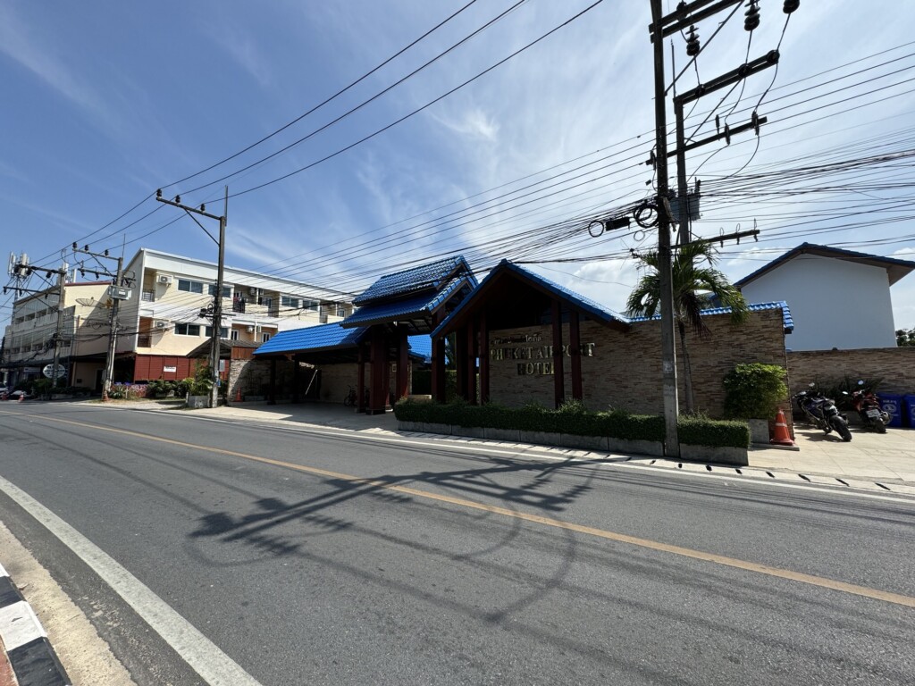 a street with power lines and buildings