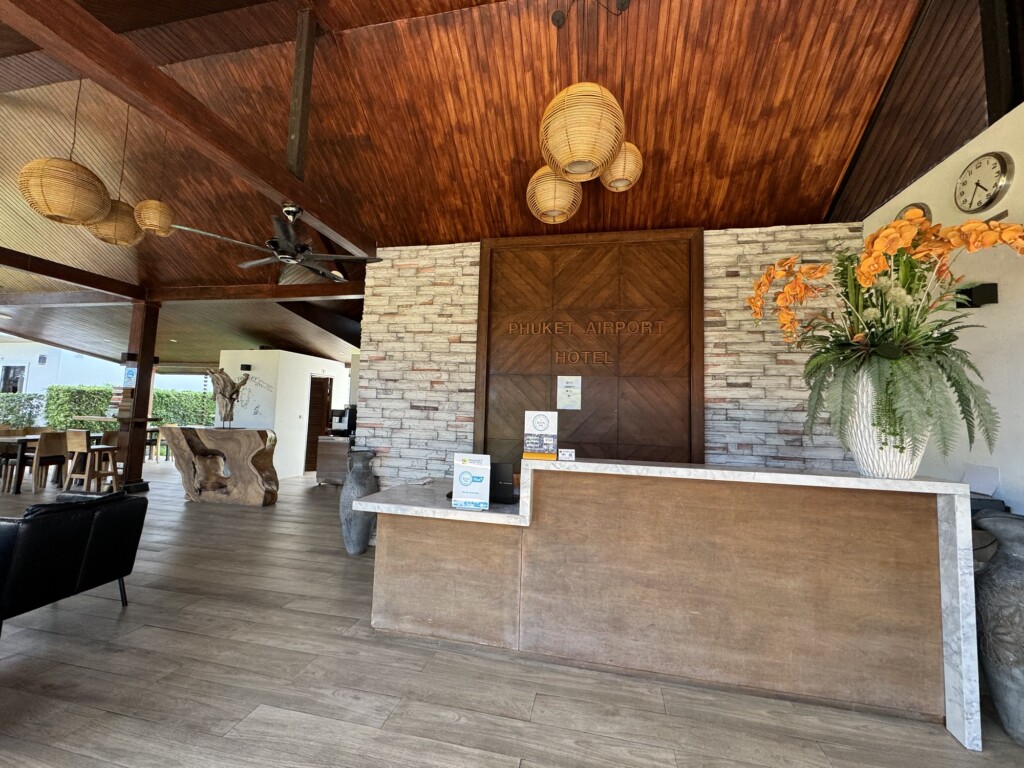 a reception area with a wood ceiling and a wood floor