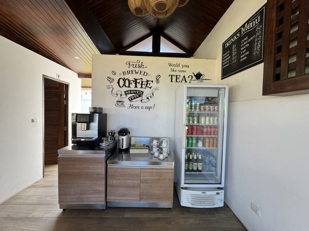 a coffee machine and beverage cooler in a room