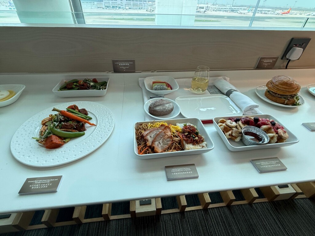 a table with plates of food and a burger
