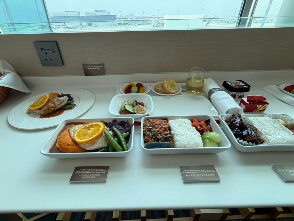 a table with plates of food and drinks