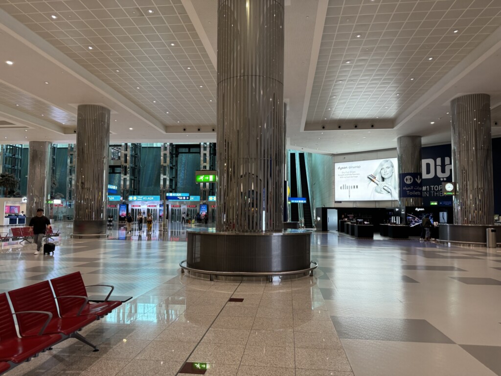 a large metal pillar in a large airport