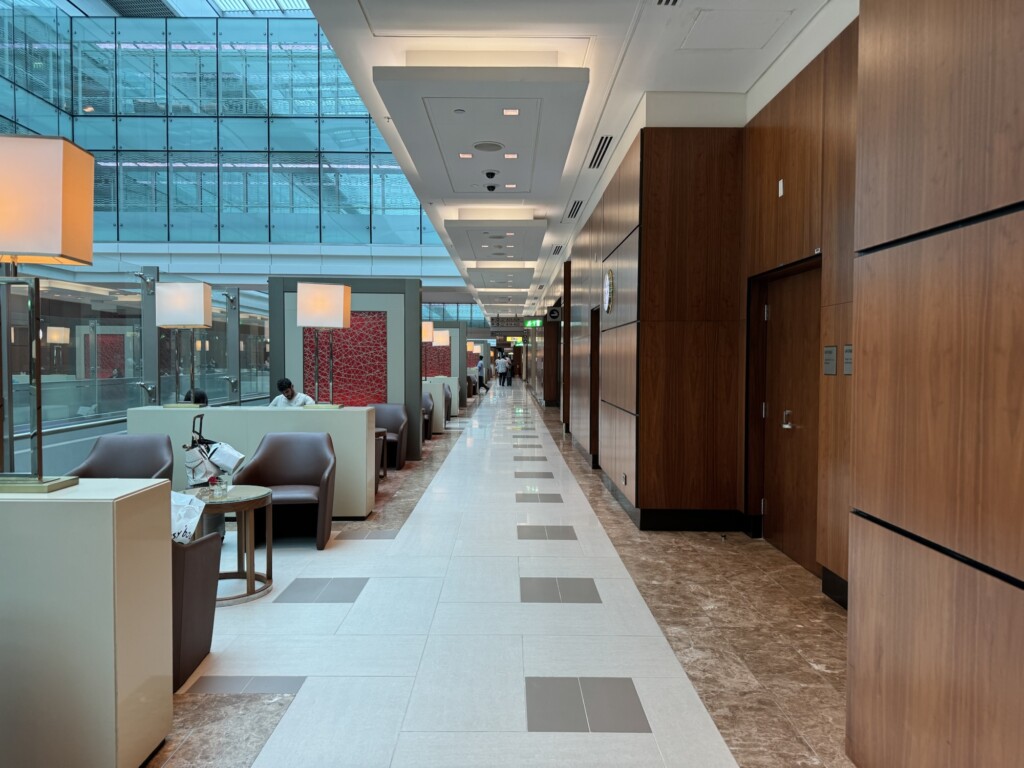 a hallway with chairs and tables